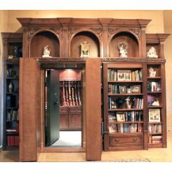 Вбудована в стіну книжкова шафа у вигляді дверей в сховище